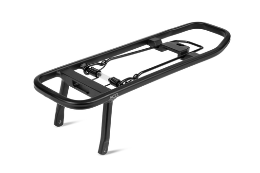 Der ACID Gepäckträgeraufsatz SIC 2.0 TOP RAIL von ACID ist ein schwarzer Gepäckträger mit gefederten Klemmen, zwei Stützbeinen und einem offenen rechteckigen Rahmen, dargestellt auf weißem Hintergrund.
