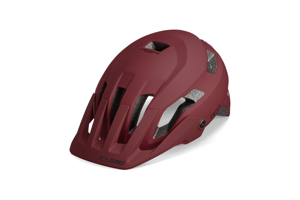Der Cube CUBE Helm FRISK / MTB Trail Helm ist ein matt dunkelroter Helm mit mehreren Belüftungsöffnungen, Frontvisier, freiliegender Innenpolsterung und erhöhtem Komfort durch das CUBE Natural Fit System, abgebildet auf weißem Hintergrund.