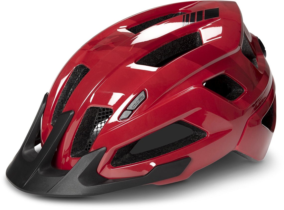 Der CUBE Helm STEEP von Cube ist ein glänzender roter All Terrain-Helm mit mehreren schwarzen Belüftungsöffnungen, einem schwarzen Frontvisier und einem schlanken aerodynamischen Design.